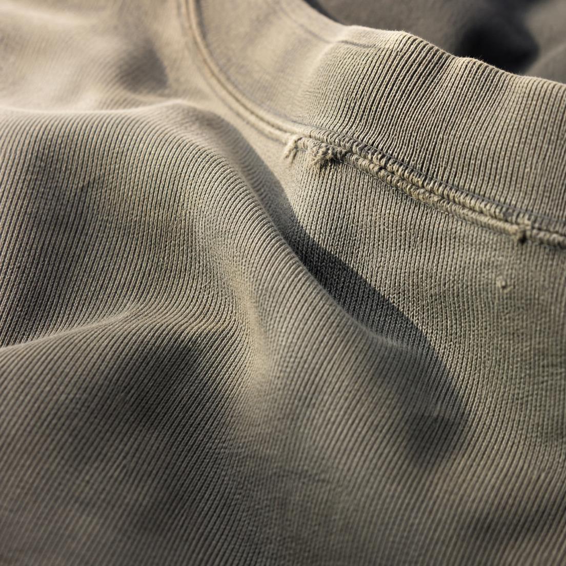 Worn heavyweight cotton with a frayed seam